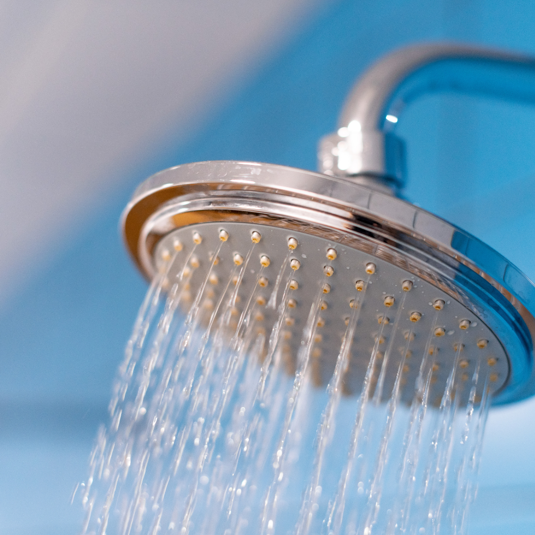 shower head turned on with water coming out