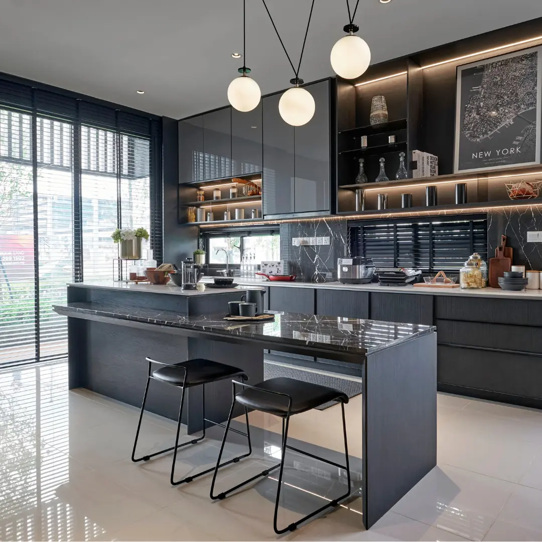 Black kitchen with lights haning from ceiling