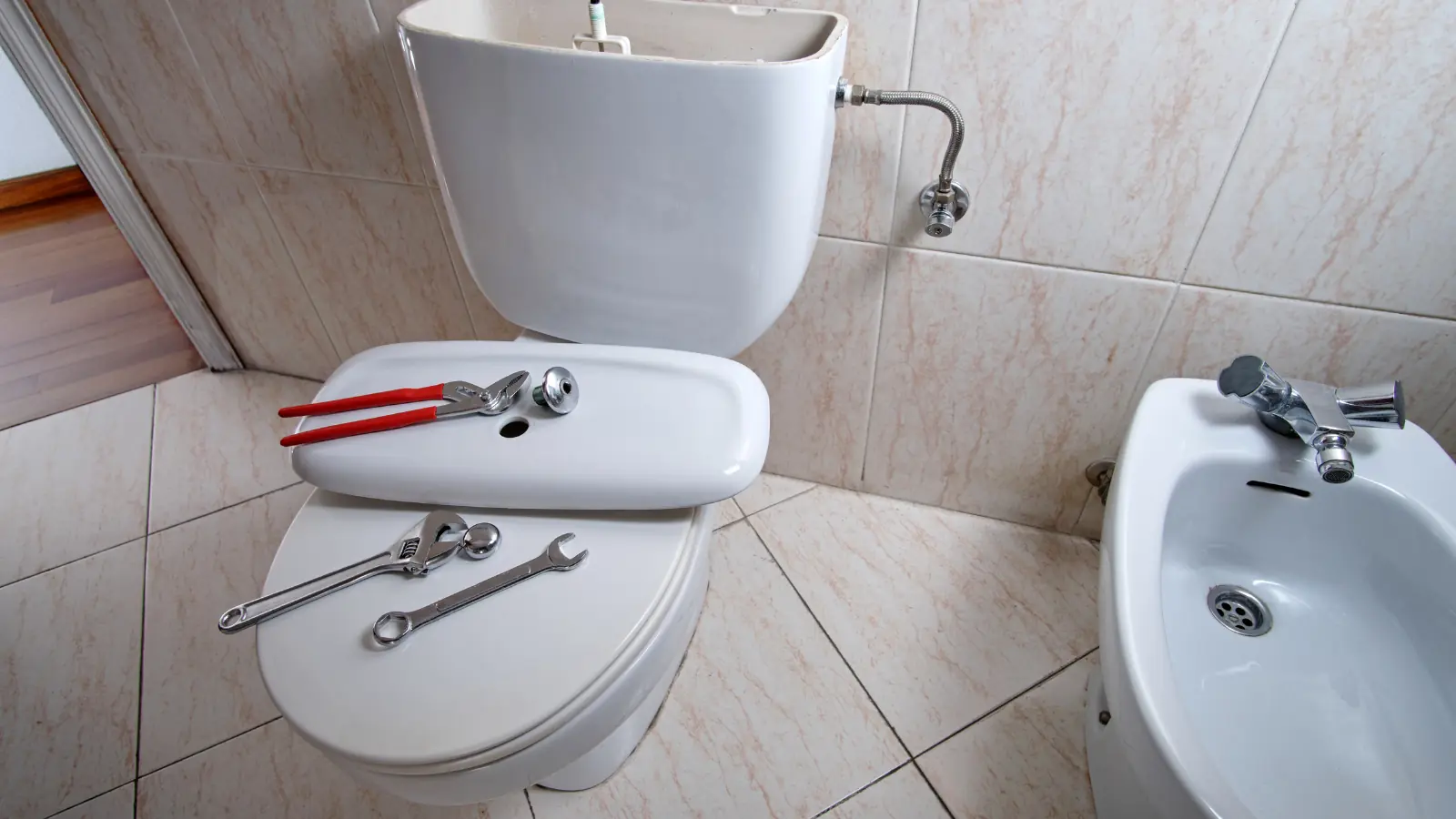 Broken toilet being fixed and repaired
